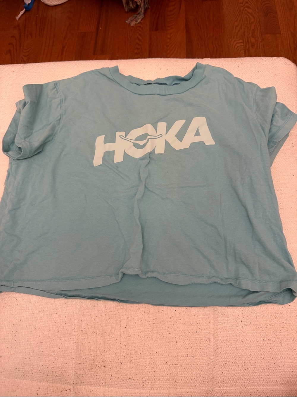 Hoka light blue graphic logo cropped short sleeve shirt